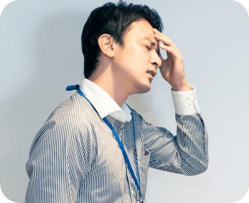 頭痛に悩む男性